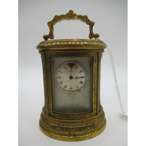 78a - Small J.W. Benson Oval Brass Carriage clock, The Dial Signed Benson Bond St, Engraved throughout wit... 