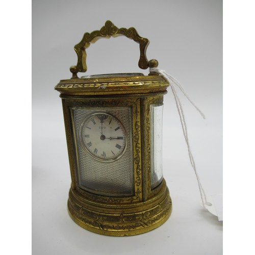 78a - Small J.W. Benson Oval Brass Carriage clock, The Dial Signed Benson Bond St, Engraved throughout wit... 