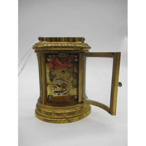 78a - Small J.W. Benson Oval Brass Carriage clock, The Dial Signed Benson Bond St, Engraved throughout wit... 