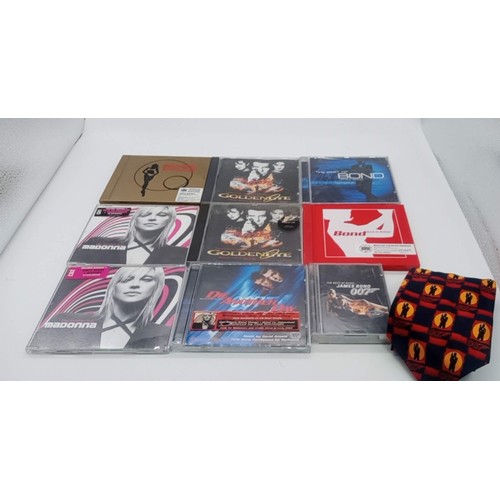 593 - A Collection of 9 x James Bond Music CD's and Tapes plus a James Bond Tie - including Madonna Die An... 