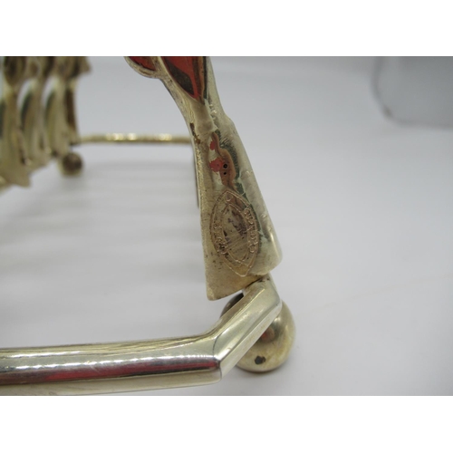 57b - A Silver Plated Toast Rack in the Form of 14 Rifles/ Crossed Muskets