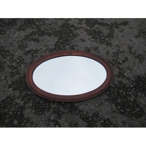 64 - A Large Wooden Framed Bevelled Glass Oval Mirror 87 x 57cm