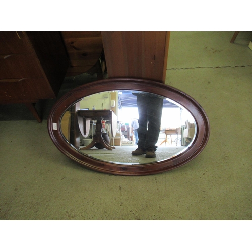 64 - A Large Wooden Framed Bevelled Glass Oval Mirror 87 x 57cm