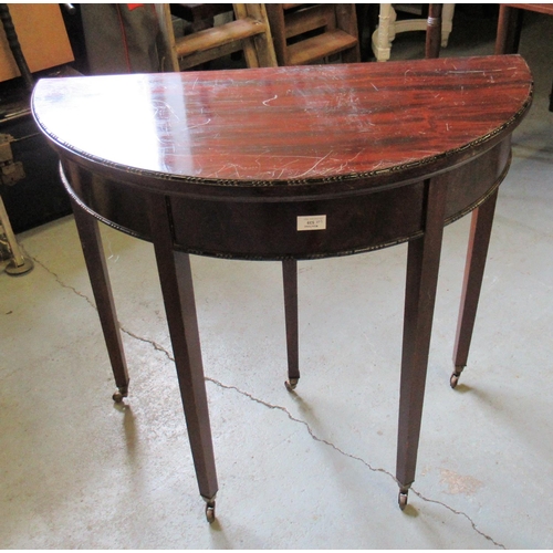 78 - A Victorian Mahogany Demi Lune Card  Table on Castors 83 x 41 x 29.5 approx.