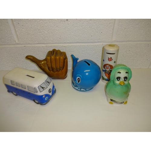 692 - A Collection of Pottery Money Boxes inc. VW Camper Van and Orville the Duck