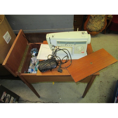 826 - A Singer Electric Sewing Machine and Table 72 x 67 x 45cm