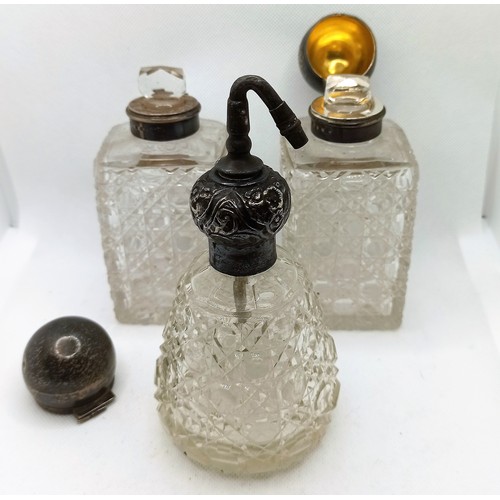 7C - A Pair of Cut Crystal Hallmarked Silver topped Vanity Bottles and Atomiser