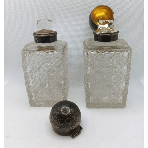 7C - A Pair of Cut Crystal Hallmarked Silver topped Vanity Bottles and Atomiser