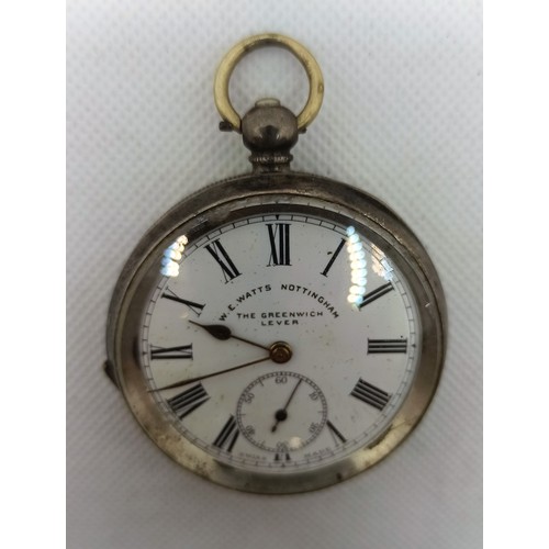 8D - A Silver W E Watts Greenwich Lever Pocket Watch with key and a ladies Silver Swiss 15 Jewell Wristwa... 