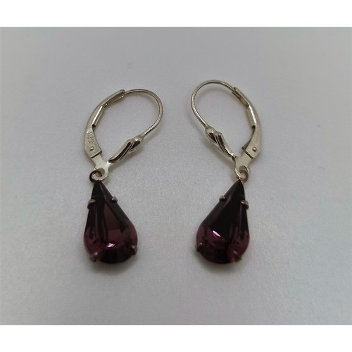 32E - A pair of Silver earrings with Amethyst coloured stones