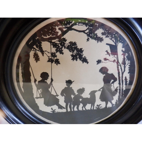 186 - An Album of 1840's Paper Silhouettes and Circular Framed Silhouette of Children Playing