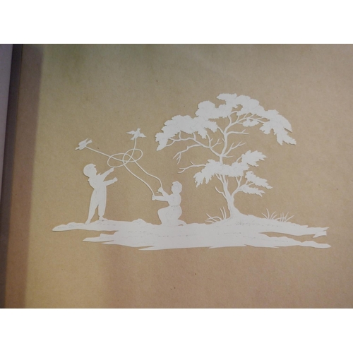 186 - An Album of 1840's Paper Silhouettes and Circular Framed Silhouette of Children Playing