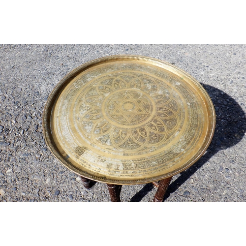 264 - A Carved Arabian Brass Topped Folding Table 68 x 60cm