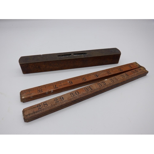 323b - A Vintage Brass Spirit Level and Folding Wooden Ruler