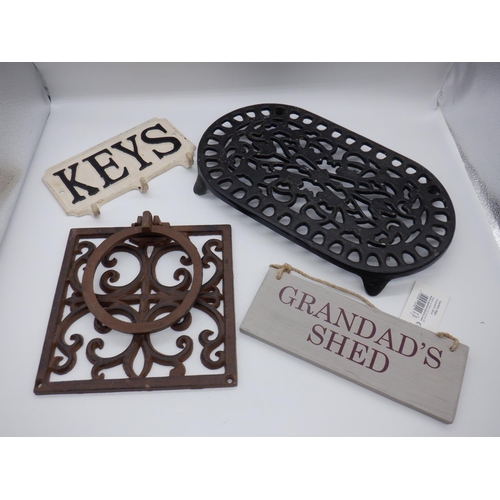 354a - An Iron Trivet, Key Hook, Plant Pot Wall Bracket and Grandads Shed Sign