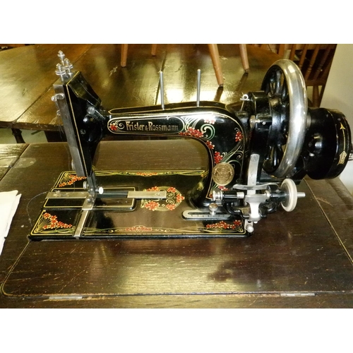 663 - An Antique Frister and Rossman Sewing Machine and Table