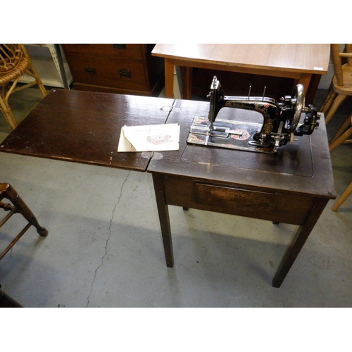 663 - An Antique Frister and Rossman Sewing Machine and Table