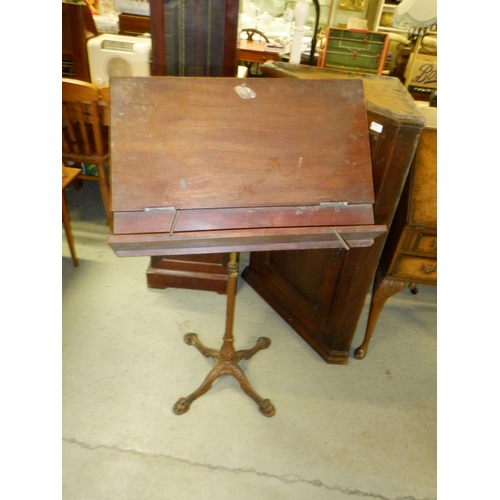 687 - An Antique Music Stand on an Iron Base