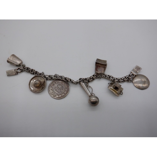 177d - A Silver Charm Bracelet 31grams