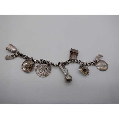 177d - A Silver Charm Bracelet 31grams