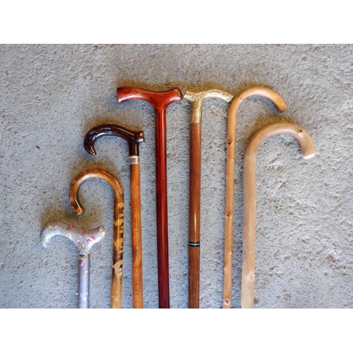 693 - 8 x Walking Sticks inc. Cane , Metal Adjustable and Others