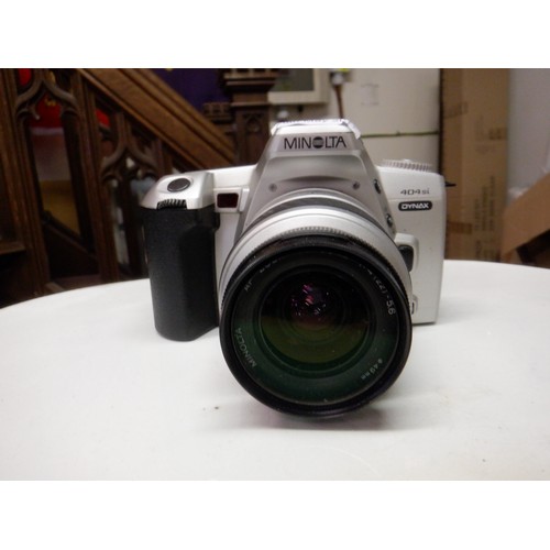 382a - A Nikon Coolpix P80 10.1 Mega Pixel Digital Camera ( missing battery cover) and a Minolta 404si SLR ... 