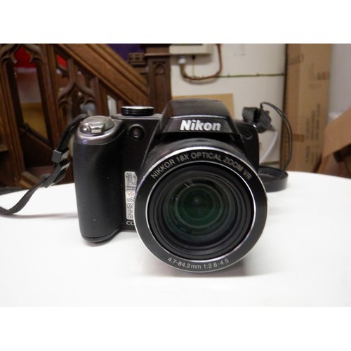 382a - A Nikon Coolpix P80 10.1 Mega Pixel Digital Camera ( missing battery cover) and a Minolta 404si SLR ... 