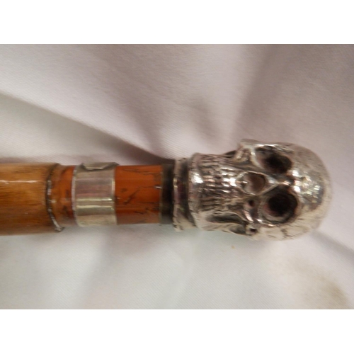 54 - A Skull Handled and Gentleman's Inscribed Walking Sticks