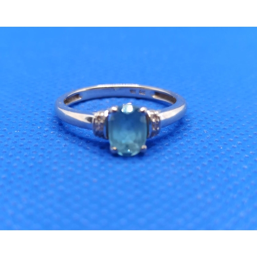 46 - A 9 Carat White Gold and Aquamarine Ring with Diamonds to the Shoulders 1.9  Grams, Size M