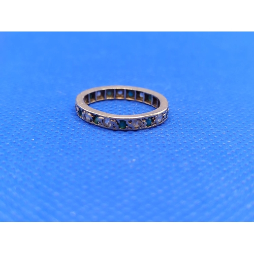 70 - 9 Carat Gild Eternity Ring Diamond and Emerald ( Missing Emerald and Misshapen) 1.7grams Total Weigh... 