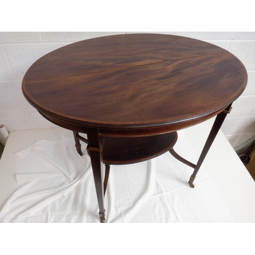 264 - Flame Mahogany Topped Oval Table with Ebony and Box Banding on Brass Castors ( split on top) 91 x 67... 