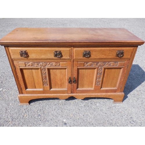 1479 - A 2 Drawer Oak Sideboard with Acanthus leaf carving on dovetailed bracket feet 152x54x93cm