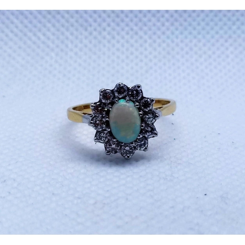 123 - A Hallmarked 18 carat Opal and Diamond Ring