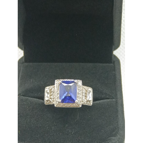 219 - A .925 Silver Dress Ring with Central Blue Stoneand CZ to Shoulders, 5.7 Grams , Size N/O