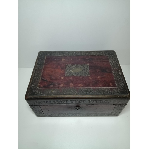 784 - An Antique Brass Bound Vanity Case