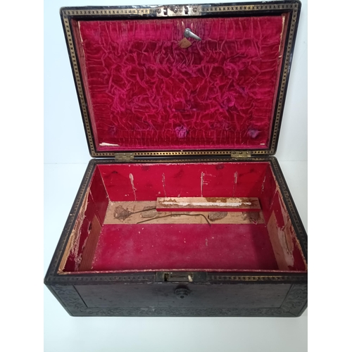 784 - An Antique Brass Bound Vanity Case