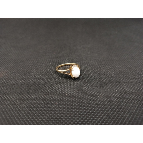 165 - A White Opal and 9 Carat Gold Ring 2.2 Grams , Size M/O