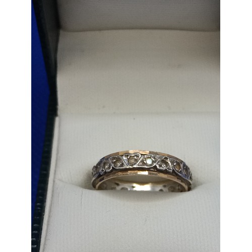 111 - A 9ct Yellow Gold Diamond and Silver Eternity Ring, Size O, 2.98 Grams