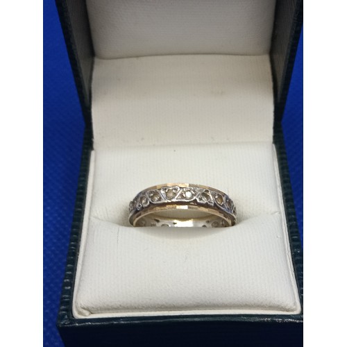 111 - A 9ct Yellow Gold Diamond and Silver Eternity Ring, Size O, 2.98 Grams