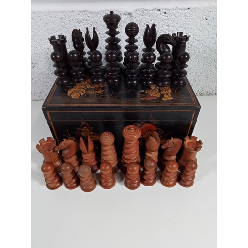 297 - A Japanese Laquerware Box of Carved Chess Pieces