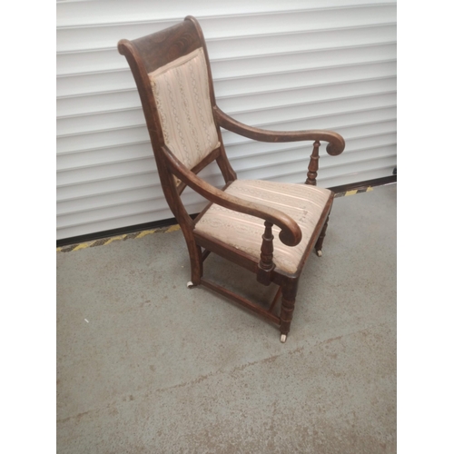 850 - An Oak Scroll Back Armchair on Castors 98cm x 62cm x 57cm