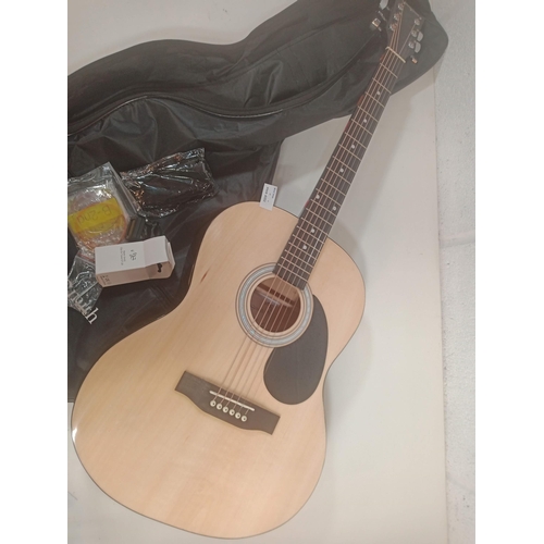 888 - A Martin Smith Natural Wood Guitar with Tuner, Spare Strings etc.