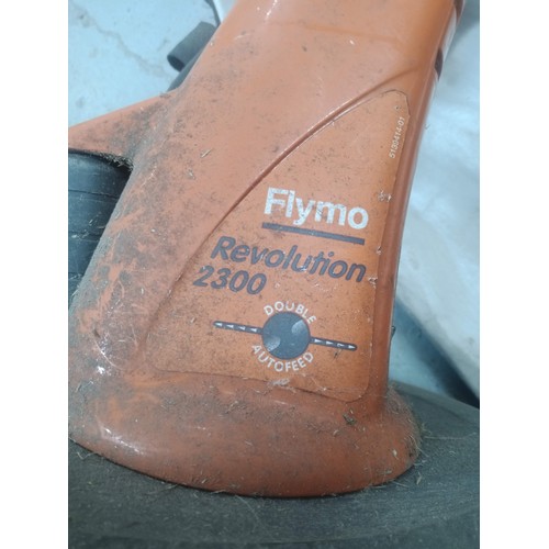 57 - Flymo Electric Revolution Strimmer and a Black and Decker Leaf Blower