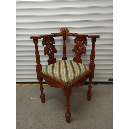 82 - Heavily Carved Corner Chair with Angel Motif