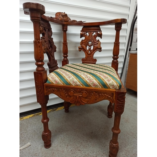 82 - Heavily Carved Corner Chair with Angel Motif