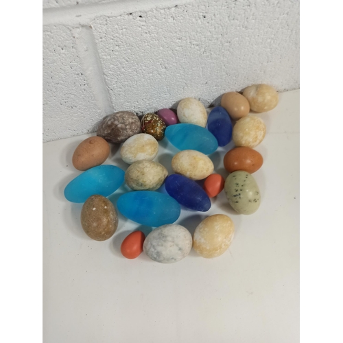 726 - A Collection of Carved Stone Eggs