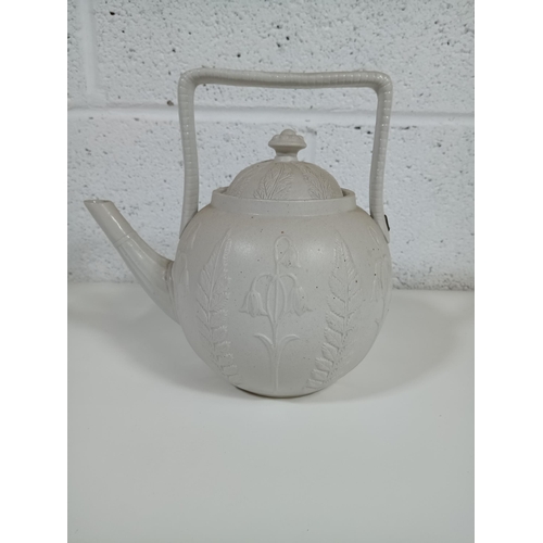 281 - An Antique Bisque Tea Pot with Staple Repair to Handle