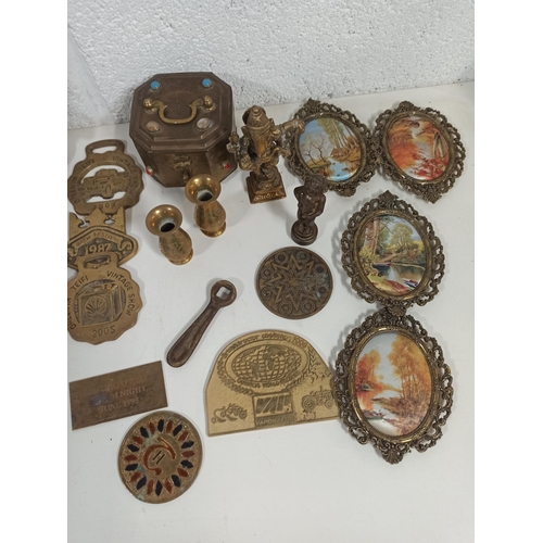 888 - An Assortment of Brass Items including Horse Brasses, Plaques, Door Knocker, Picture Frames and More