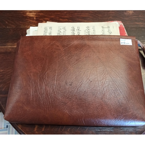 166B - A Leather Case Containing Assorted Sheet Music