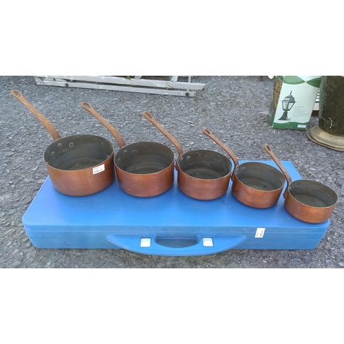 97 - A Collection of Vintage Graduated Copper Pans